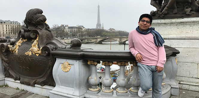 Abdiel Lopez ’18 in France. The Eiffel Tower is in the background. 