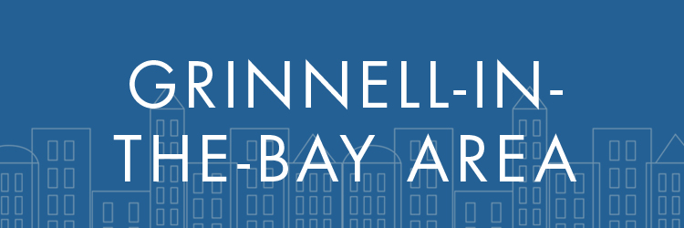 White text on a blue background. Text: Grinnell in-the-Bay Area. Behind the text in a gray skyline.