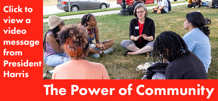 Image and Text. Image: President Harris sits in a small group with incoming first-years during NSO. Text: The Power of Community. Click to view a video message from President Harris. 