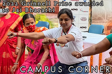 Text: Campus Corner - 2022 Grinnell Prize awarded to Jai Bharathi. Image: Jai Bharathi demonstrates the riding position of a motorcycle.