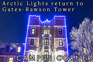 Text: Campus Corner - Arctic Lights return to Gates-Rawson Tower. Image: Gates-Rawson Tower illuminated with a blue light outline. 