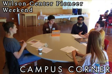 Text: Campus Corner - Wilson Center Pioneer Weekend. Image: Students work together on a project around a circular table.
