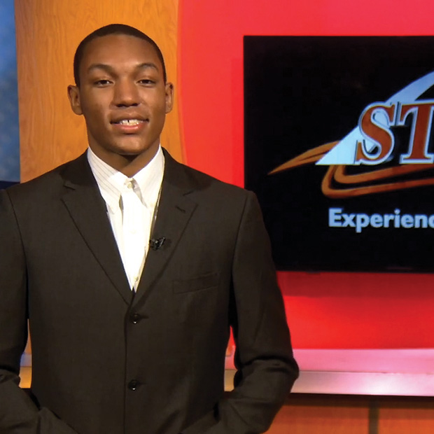 Jordon Ryan ’24 presents in front of a TV monitor as part of his internship with StlTV.