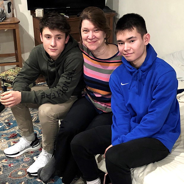Karen Fuller, middle, is pictured with her sons, Thomas, left, and Az at their home in Brooklyn. 