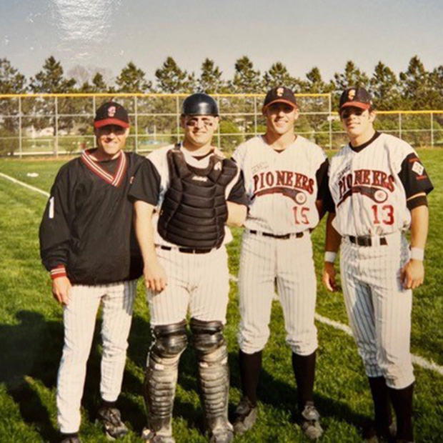 Jim Schueller ’03, right, stands with Pioneers Coach Tim Hollibaugh, left, Jim Bombulie ’03 and Shawn Sigler ’03.