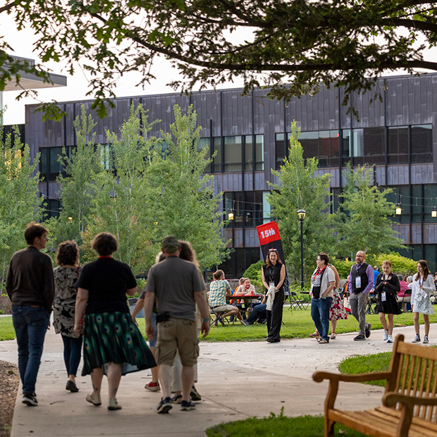 Reunion attendees stroll through Central Campus during the Reunion 2025 Block Party.