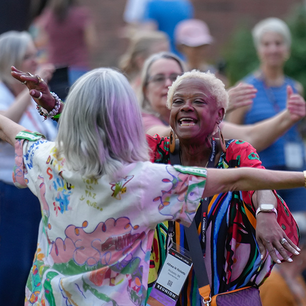 Althea Ricketts &rsquo;86 hugs a classmate.