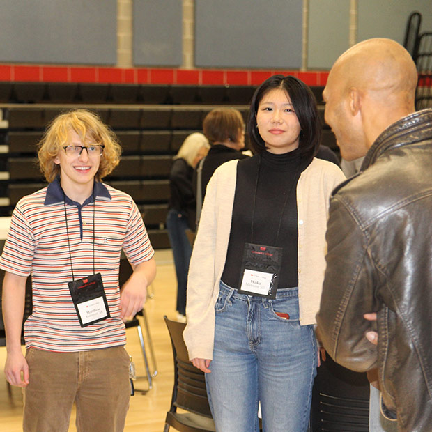 Matthew Katsman &rsquo;28 and Waka Mimuro &rsquo;28 talk with Alumni Council member Anton Jones &rsquo;02.