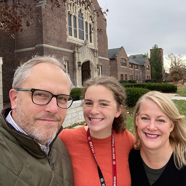 The Seehorn family posed in front of Herrick Chapel on the campus of Grinnell College.