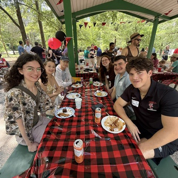 Two young Alumnae chat during a Grinnell Summer Picnic.
