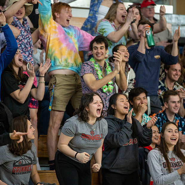 Grinnell students cheer during a Women's Basketball game.