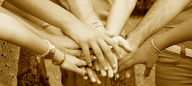 Hands reached into a huddle