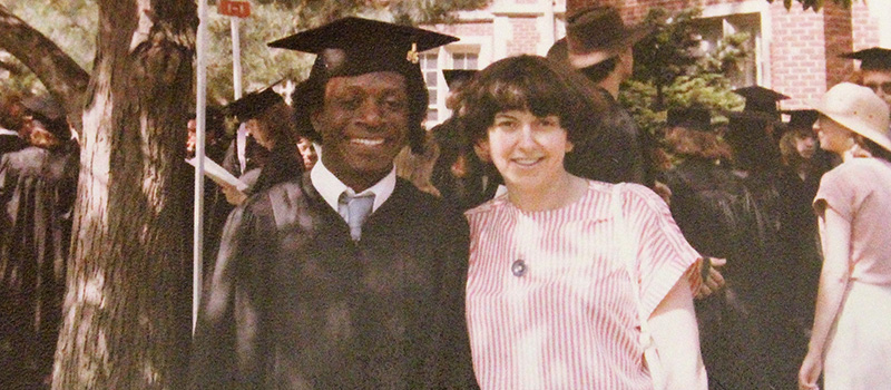 Nicole Hamon poses with Rex Osae ’85 after the 1985 commencement ceremony.